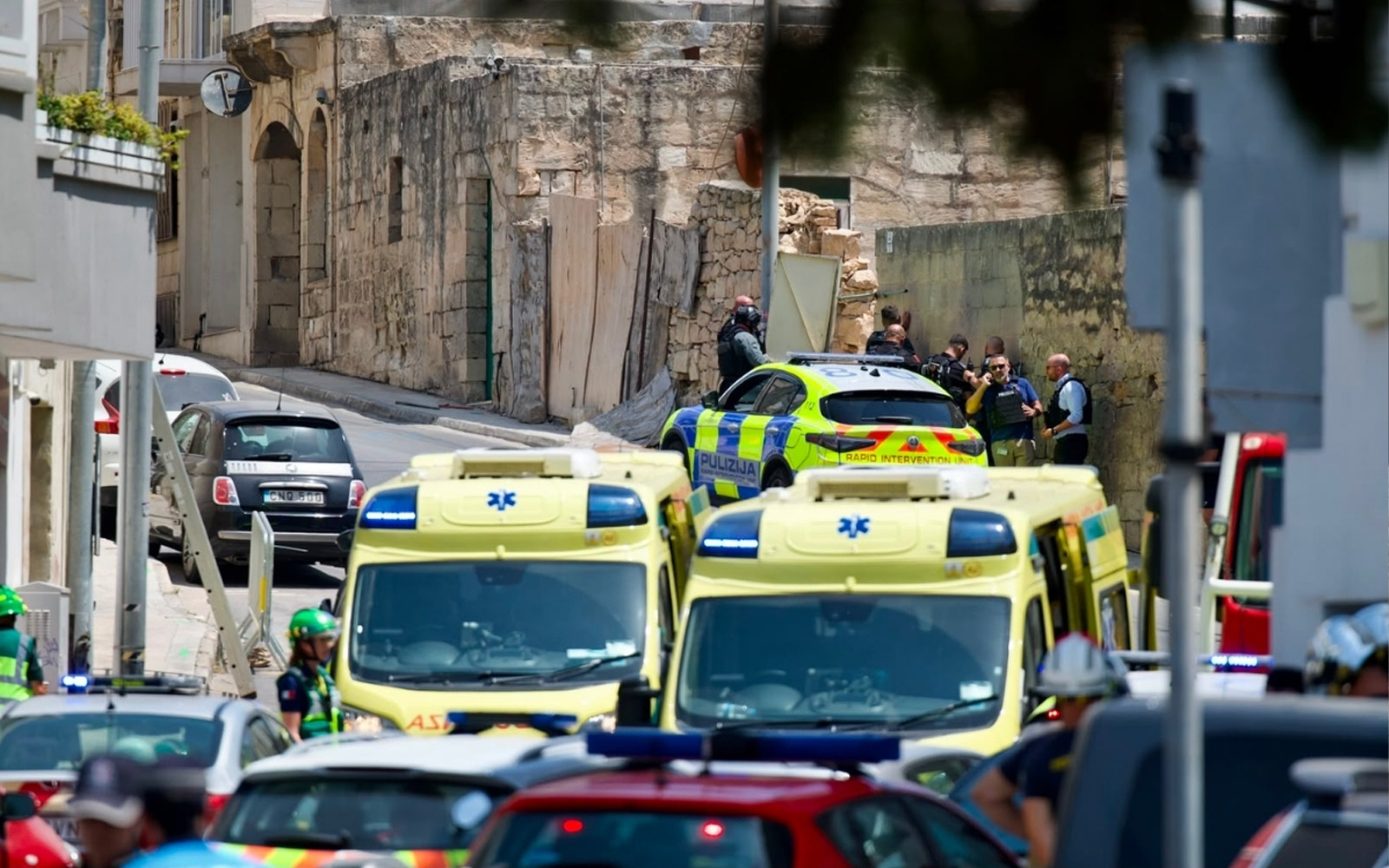 Police officers deployed in the Ta’ Giorni area of San Ġwann following a shooting that left two officers injured and resulted in two arrests.