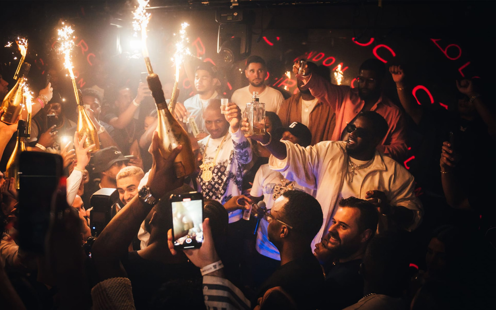 Lit sparklers being used during an indoor celebration