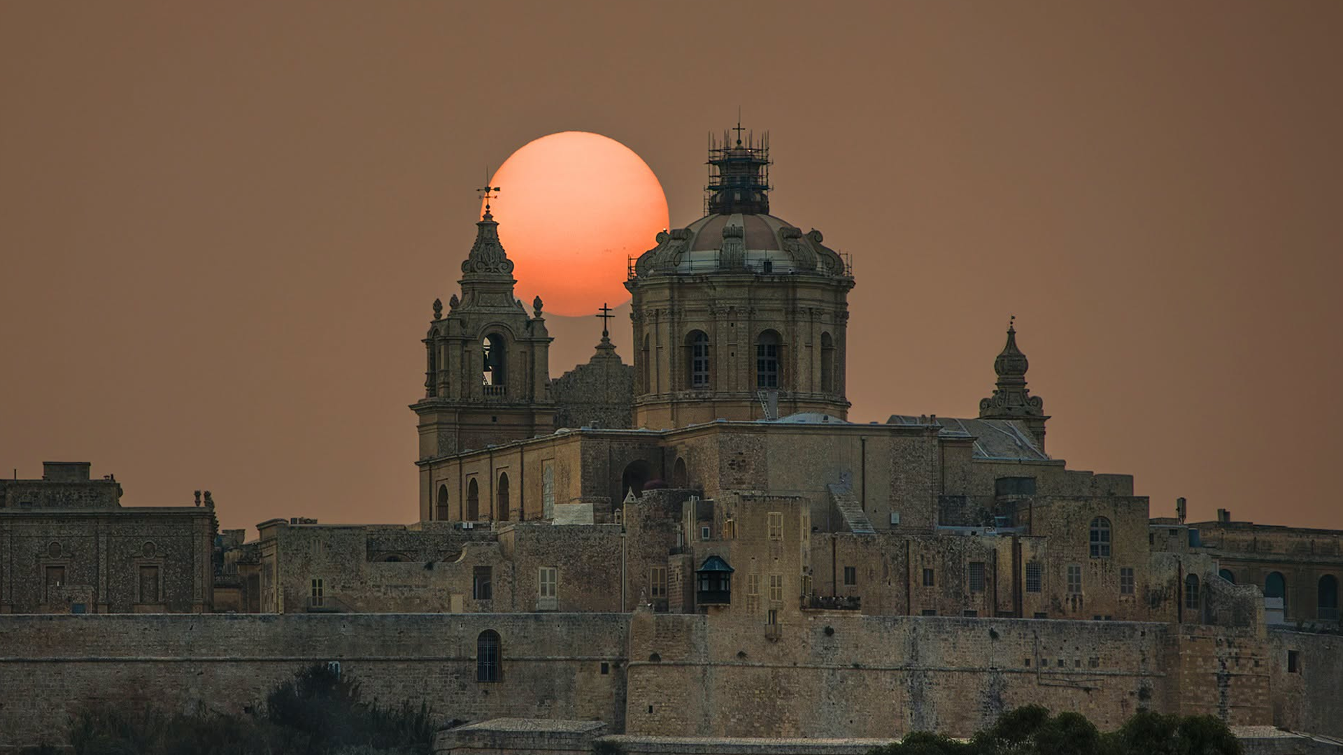 Saharan Dust Turns Mdina Sunset Into a Striking Orange Spectacle